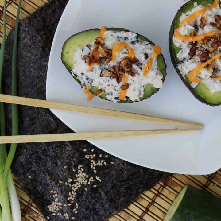 This quick and easy California Sushi Roll Stuffed Avocado is a perfect, no cook keto lunch or dinner for summer--or anytime! #ketosushi #keto #californiasushiroll #dinner #stuffedavocado