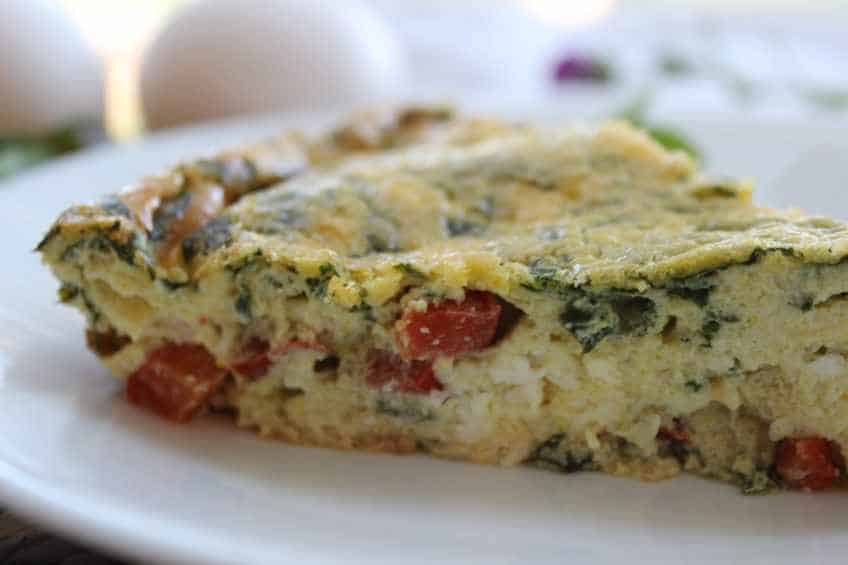 One of my favorite easy keto dinners or breakfasts is a crustless quiche! You can try to make a ketogenic crust, or just go crustless! This crustless spinach red pepper feta quiche is delicious! #quiche #ketoquiche #crustlessquiche