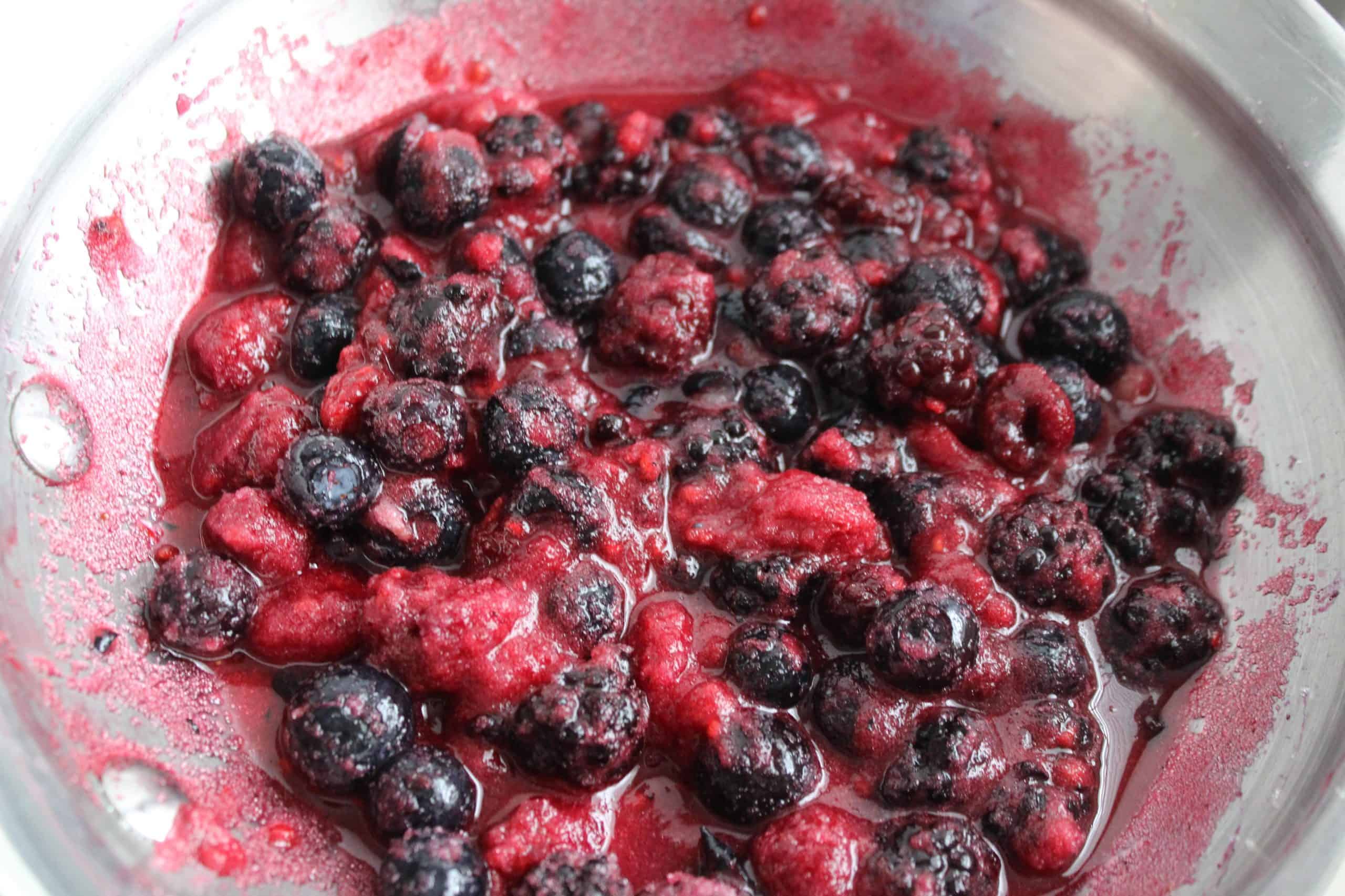 Simmer berries 10 minutes for keto mixed berry topping for cheesecake