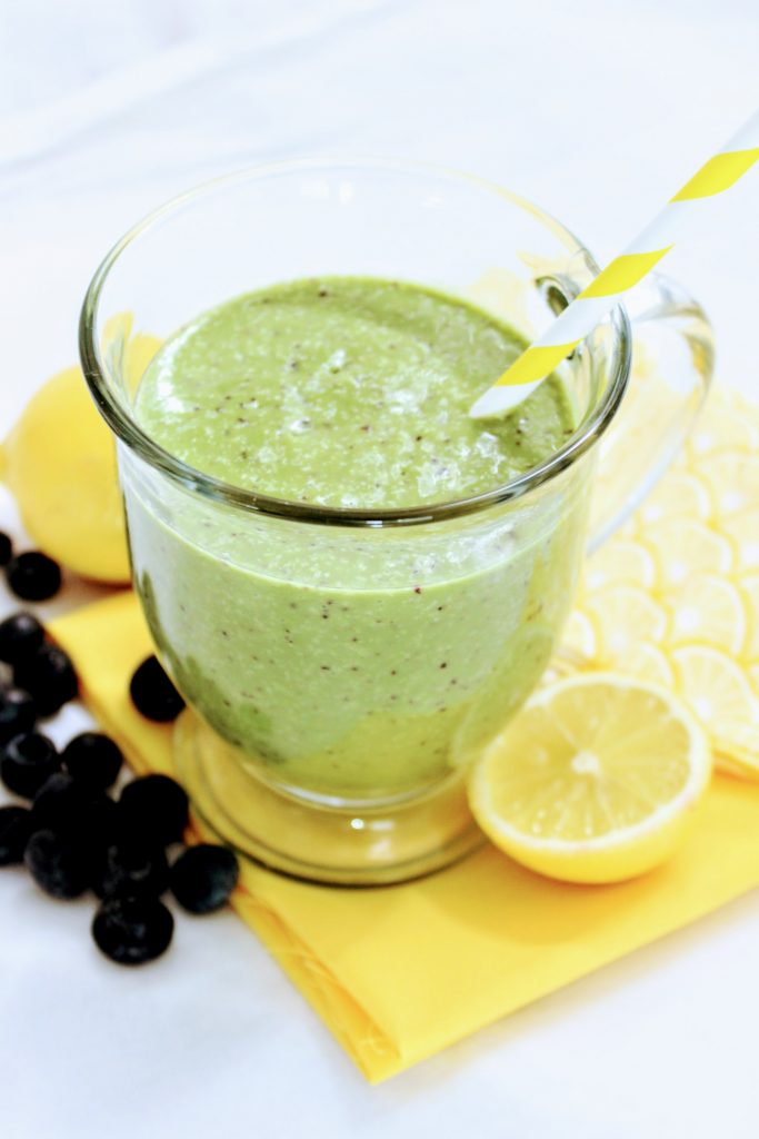 Keto Jamba Juice copycat green smoothie on napkin with berries and lemon
