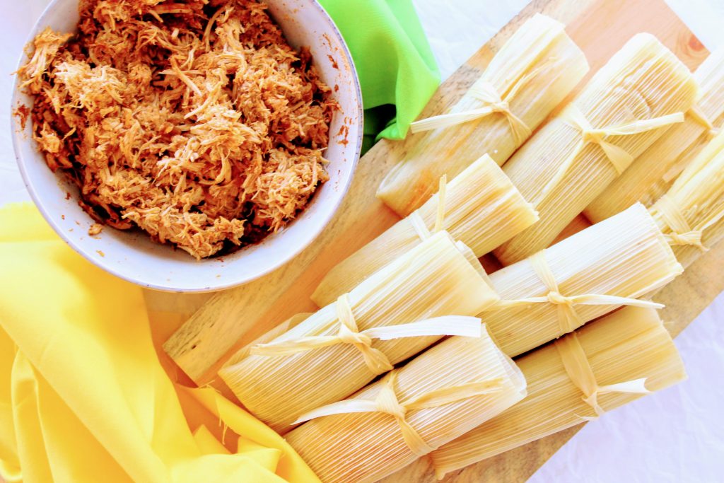 Keto tamales wrapped and tied and red chile pork